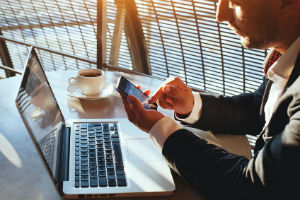 Business Man on Electronic Devices