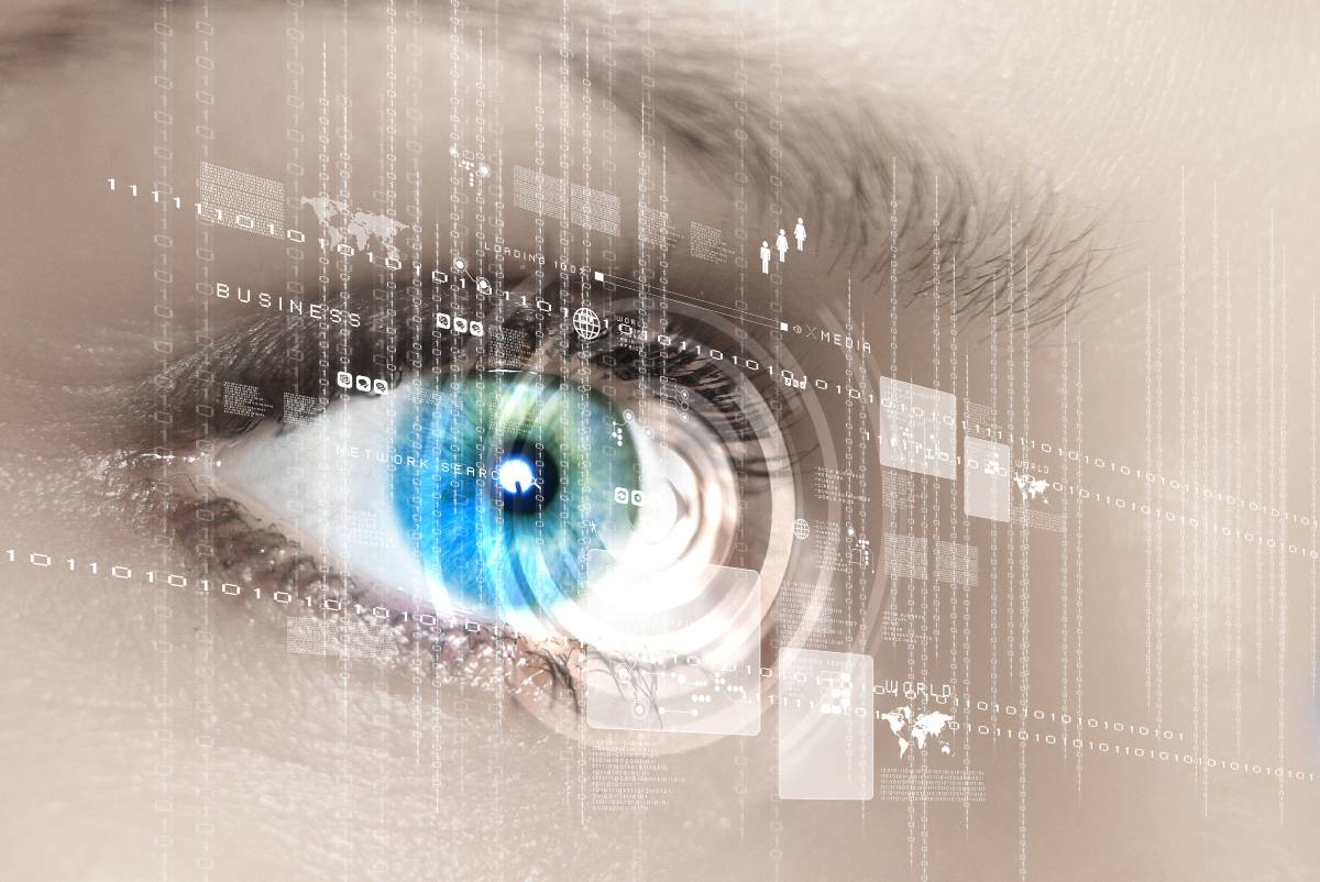 A woman's blue eye overlaid with artificial intelligence icons and images