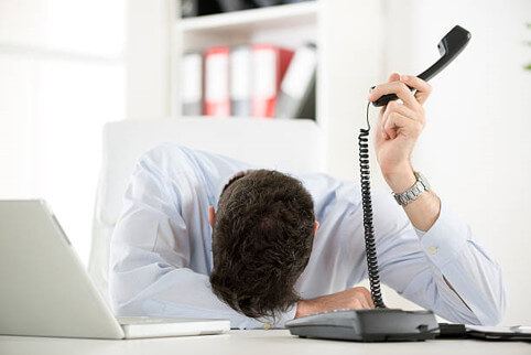Frustrated man on hold