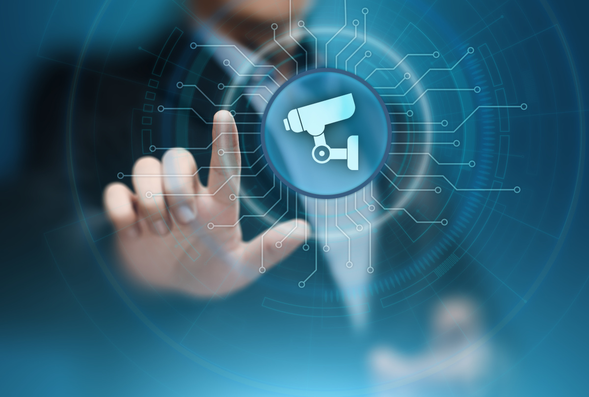 A man pointing his finger at a surveillance camera icon
