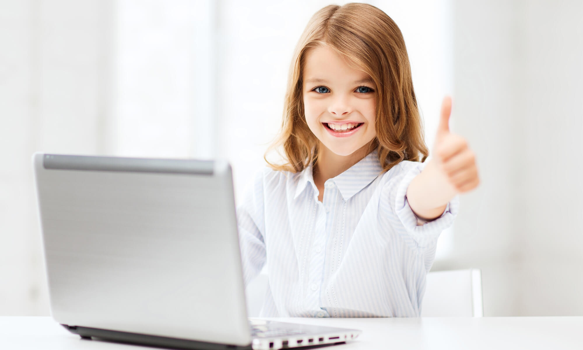 Girl student studying on laptop due to BTS' Computers for Kids program