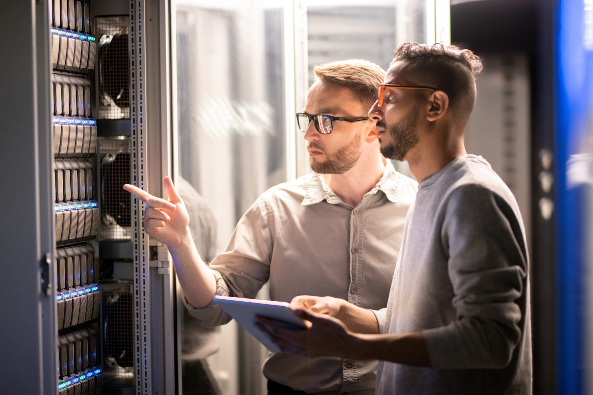 Two people assessing hardware