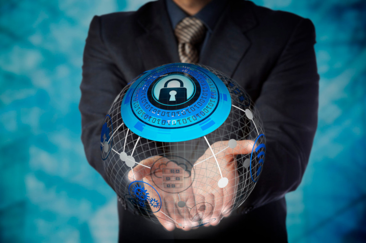 Man holding a digital globe with data and security features