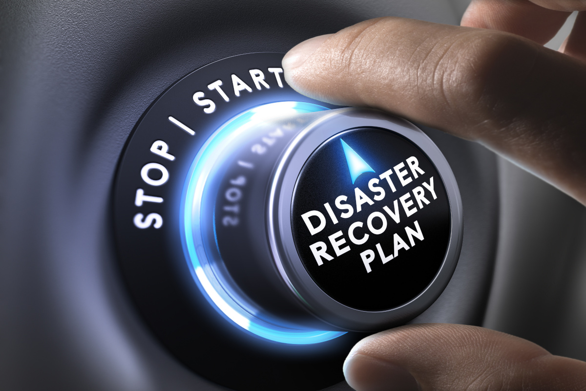 Man turning on disaster recovery button