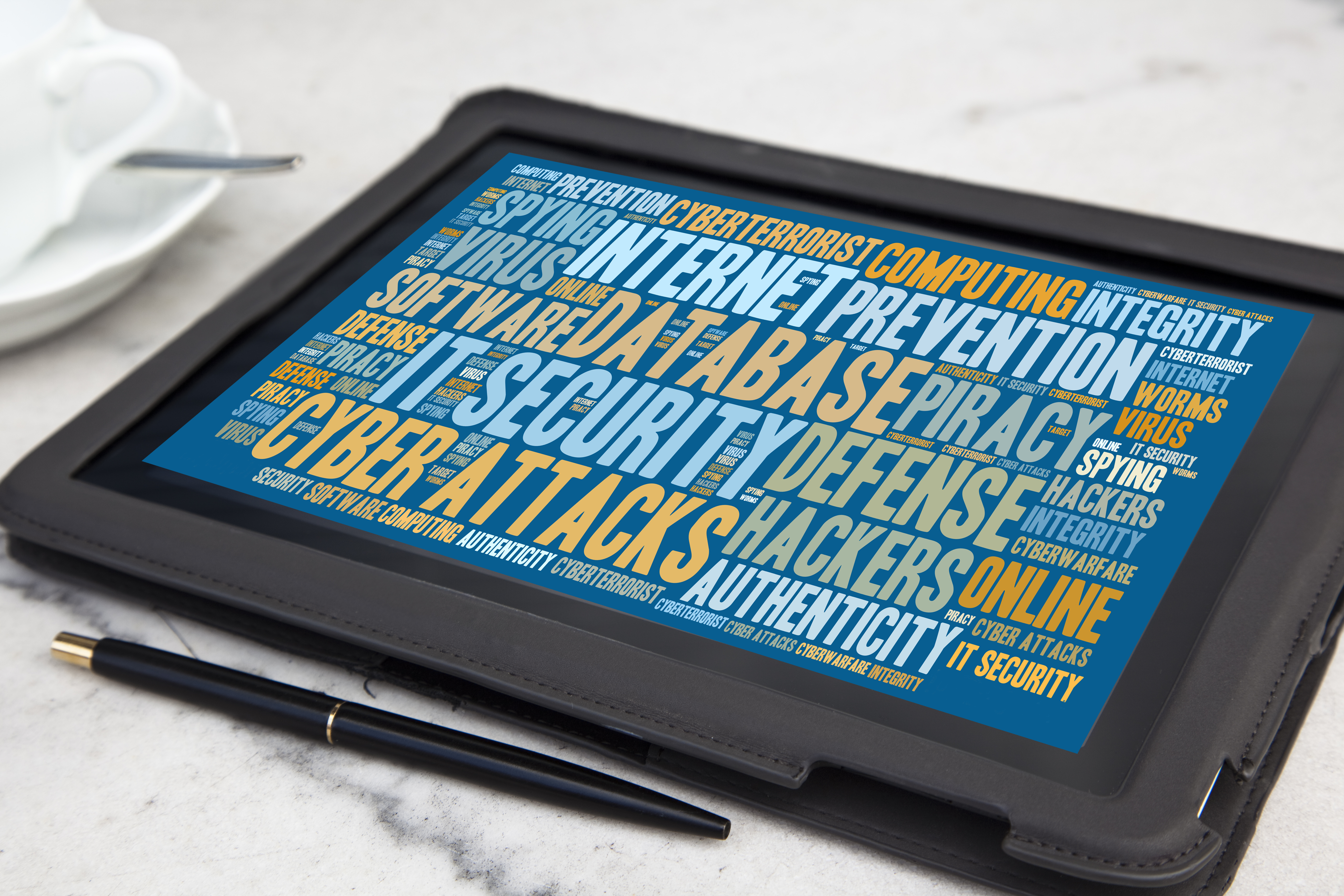 Cybersecurity keywords on a tablet