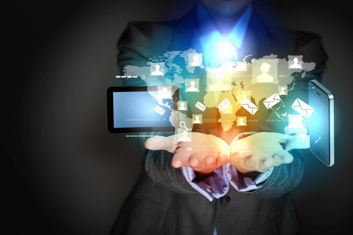 Man holding digital connection icons ih his hands
