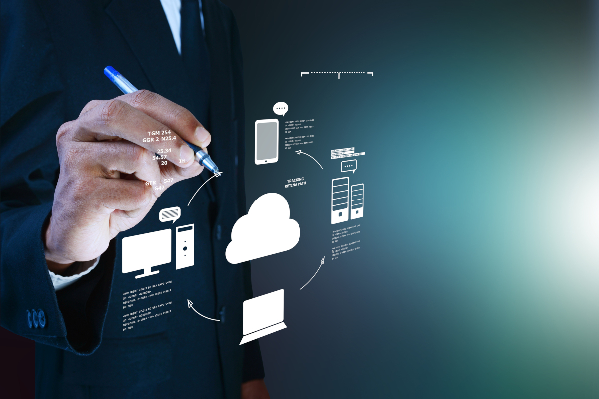 Man digitaly writing cloud and devices icons