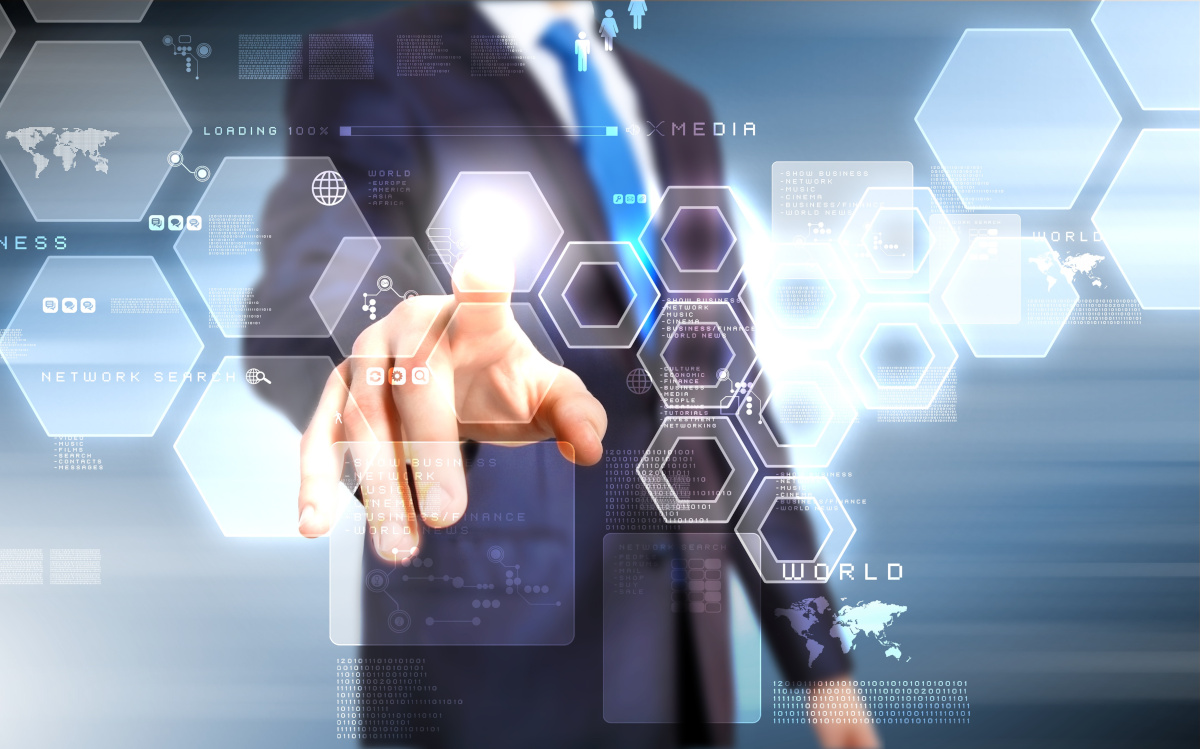 A man in a business suit pointing at digital hexagons