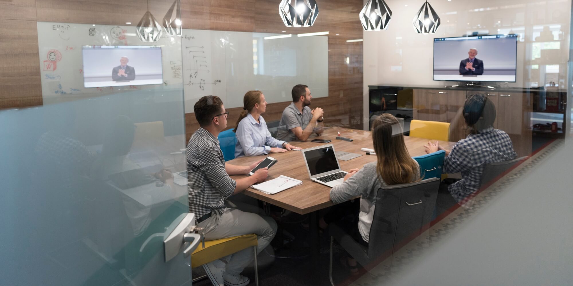 Group of businessman wathing video in conference room