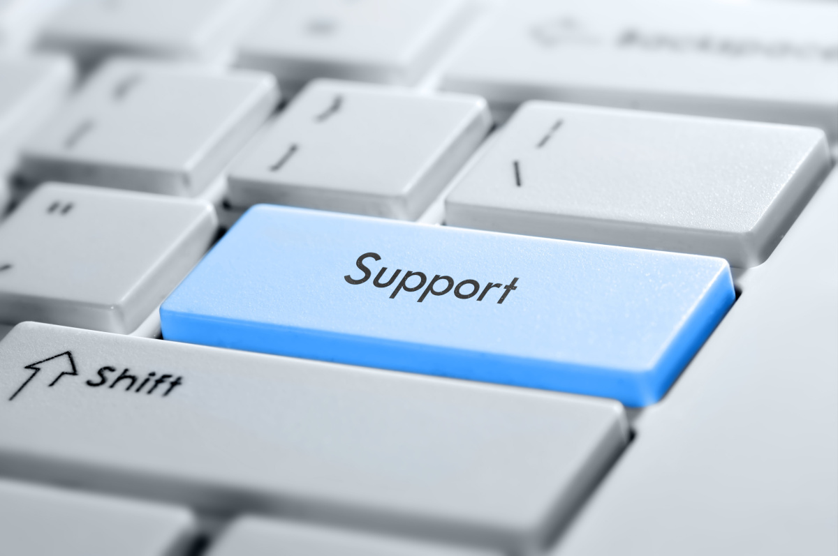 A blue keyboard key that says support on a keyboard