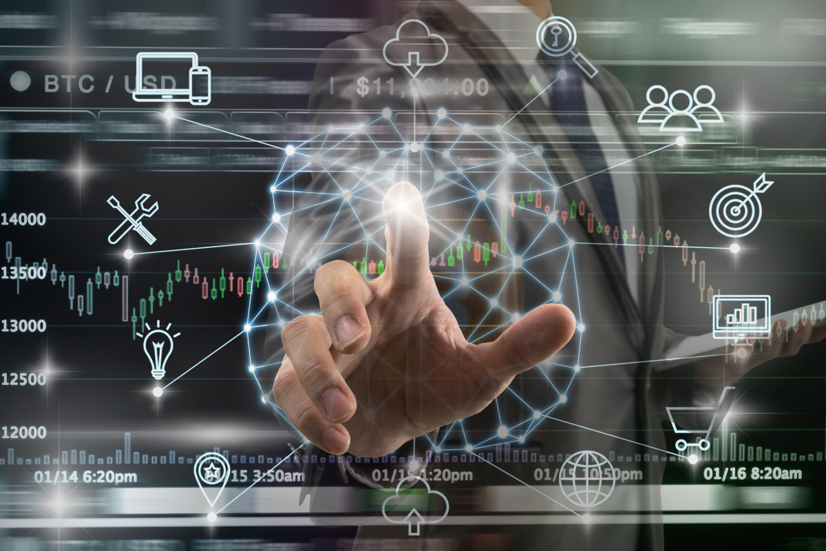 Man pointing finger at digital background with managed it icons