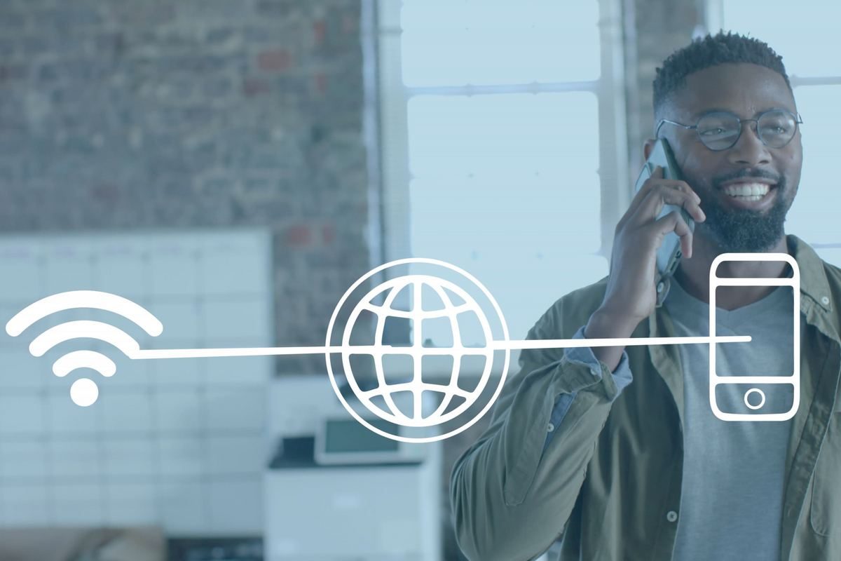 Man on a phone with Wi-Fi, globe, and smartphone icons drawn across the frame.
