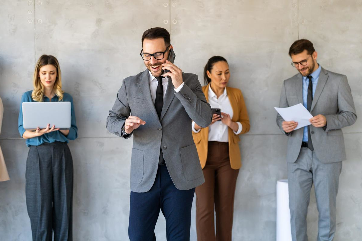 Business people on mobile phones.