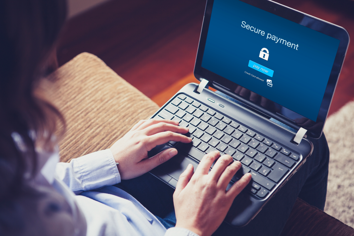 Woman typing on laptop keyboard